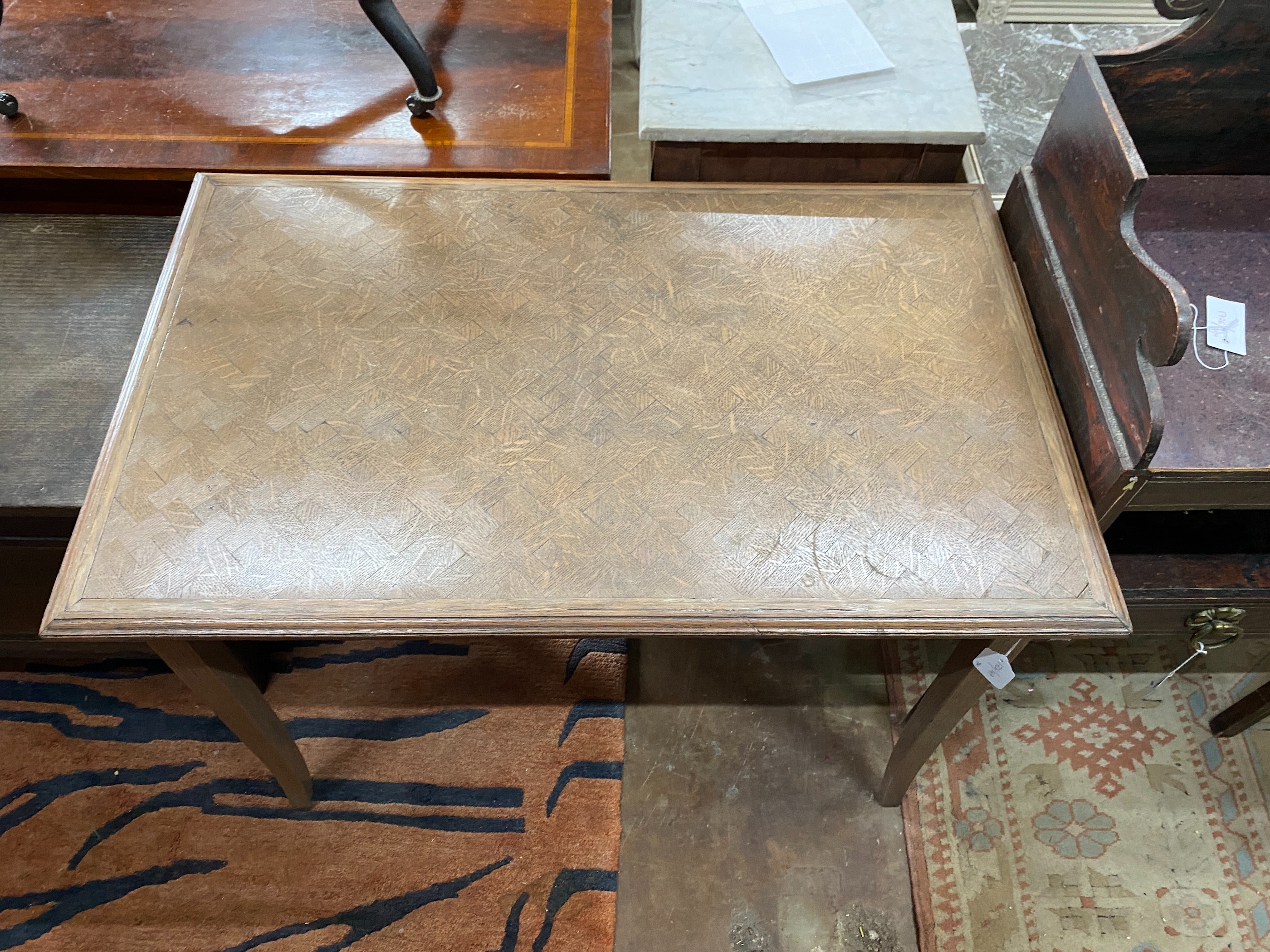 An early 20th century rectangular oak parquetry side table, width 92cm, depth 57cm, height 71cm together with a French caned side chair